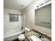 Clean bathroom featuring a shower-tub combo with a vanity and granite countertop at 2343 Deer Pass Way, Decatur, GA 30035