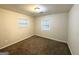 Bright bedroom with carpeted floors, two large windows and neutral walls at 2343 Deer Pass Way, Decatur, GA 30035
