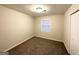 Neutral bedroom with carpeted floors and a large window providing ample natural light at 2343 Deer Pass Way, Decatur, GA 30035