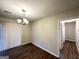 Cozy dining room with modern lighting and access to the outdoor patio at 2343 Deer Pass Way, Decatur, GA 30035