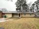 Traditional brick home featuring a manicured lawn and a classic, welcoming facade at 2343 Deer Pass Way, Decatur, GA 30035
