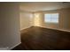 The living room with wood flooring offers a neutral palette and a bright, airy ambiance at 2343 Deer Pass Way, Decatur, GA 30035