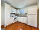 Bright kitchen featuring white cabinets, modern appliances, and hardwood floors at 488 N Jeff Davis Dr, Fayetteville, GA 30214