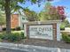 Community sign for Jeff Davis Intown Condominiums surrounded by lush greenery at 488 N Jeff Davis Dr, Fayetteville, GA 30214