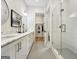 Modern bathroom featuring a double sink vanity, walk-in shower and closet at 130 Glasgow Ln, Fayetteville, GA 30214
