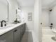 Bathroom with double sinks, modern fixtures, and a bathtub, offering a functional and stylish space at 130 Glasgow Ln, Fayetteville, GA 30214