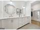 Elegant bathroom featuring dual sinks, a marble countertop, and a walk-in shower at 130 Glasgow Ln, Fayetteville, GA 30214