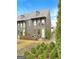 Charming brick townhome featuring a private courtyard and beautiful landscaping at 130 Glasgow Ln, Fayetteville, GA 30214