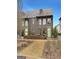 Townhome exterior featuring a brick facade, well-maintained landscaping, and charming curb appeal at 130 Glasgow Ln, Fayetteville, GA 30214