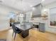 Modern kitchen with stainless steel appliances and an adjacent dining area at 130 Glasgow Ln, Fayetteville, GA 30214