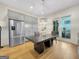 Open-concept kitchen featuring stainless steel appliances and custom cabinetry at 130 Glasgow Ln, Fayetteville, GA 30214
