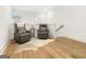Upstairs loft featuring two comfortable lounge chairs, neutral colors, and natural light creating a relaxing retreat at 130 Glasgow Ln, Fayetteville, GA 30214