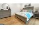 Comfortable main bedroom featuring hardwood floors and recessed lighting at 130 Glasgow Ln, Fayetteville, GA 30214