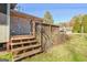 Back porch showing wooden steps with hand railing leading to the back yard at 185 Redwood Cir, Fayetteville, GA 30214