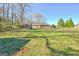 A lush backyard offers ample space for recreation, trampoline and relaxation at 185 Redwood Cir, Fayetteville, GA 30214