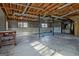 Unfinished basement with exposed wood ceiling, windows, and metal support beams at 185 Redwood Cir, Fayetteville, GA 30214