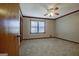 Neutral bedroom with carpet, ceiling fan, and natural light at 185 Redwood Cir, Fayetteville, GA 30214