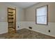 Secondary bedroom with closet, window, wainscotting, and neutral paint at 185 Redwood Cir, Fayetteville, GA 30214