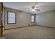 Bedroom with ceiling fan and two windows for ample natural light at 185 Redwood Cir, Fayetteville, GA 30214