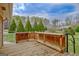Spacious wooden deck offering outdoor living, complemented by mature trees at 185 Redwood Cir, Fayetteville, GA 30214