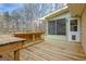 Wooden deck with wooden railings, perfect for outdoor gatherings with easy access to sunroom at 185 Redwood Cir, Fayetteville, GA 30214