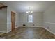 Bright dining room with updated flooring and classic chandelier lighting at 185 Redwood Cir, Fayetteville, GA 30214