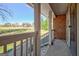 Inviting front porch view with white railing and a glimpse of the expansive front yard at 185 Redwood Cir, Fayetteville, GA 30214