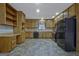 Functional kitchen with ample cabinet space and modern black appliances at 185 Redwood Cir, Fayetteville, GA 30214