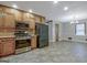 Modern kitchen featuring stainless steel appliances and tile flooring at 185 Redwood Cir, Fayetteville, GA 30214