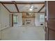 Inviting living room boasts a brick fireplace, ceiling fan, and wood beam accents at 185 Redwood Cir, Fayetteville, GA 30214