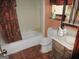 Cozy bathroom with a bathtub, shower, toilet, and sink at 7755 Chase Woods Dr, Jonesboro, GA 30236