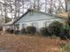 Charming single-story home with a classic design and mature landscaping at 7755 Chase Woods Dr, Jonesboro, GA 30236