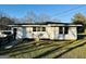 Side view of house with ramp, white siding, and a DirectTV satellite dish on its exterior at 225 Bell St, Covington, GA 30016