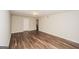 View of a finished basement featuring wood-look flooring, neutral paint, and a large open space at 3417 Little Beth Ct, Decatur, GA 30034