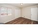 Bedroom featuring wood-look floors, a window, and large closet at 3417 Little Beth Ct, Decatur, GA 30034