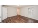 Bright bedroom with wood-look floors, neutral paint and a window providing natural light at 3417 Little Beth Ct, Decatur, GA 30034