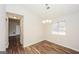 Dining room featuring contemporary lighting fixture, a large window, and hardwood flooring at 3417 Little Beth Ct, Decatur, GA 30034