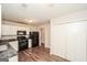 Efficient kitchen with white cabinetry, a full suite of appliances, and wood look floors at 3417 Little Beth Ct, Decatur, GA 30034