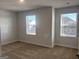 Bright bedroom with carpet, two windows, and a view of the neighborhood at 5314 Tolar Rd # 23, South Fulton, GA 30213