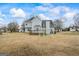 Exterior of home with a backyard featuring a wooden deck and swing set at 825 Karie Dr, Mcdonough, GA 30253