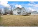 Backyard of home featuring a wooden deck and spacious lawn at 825 Karie Dr, Mcdonough, GA 30253