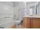 A functional bathroom with a shower-tub combo, vanity, and updated fixtures provides convenience at 825 Karie Dr, Mcdonough, GA 30253