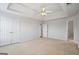 Well-lit bedroom offers closet space, an ensuite, and a ceiling fan at 825 Karie Dr, Mcdonough, GA 30253