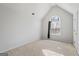 Bedroom with vaulted ceiling, neutral carpet, a window, and a closet at 825 Karie Dr, Mcdonough, GA 30253