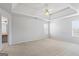 A bright and spacious bedroom with large windows and ceiling fan, ensuring comfort at 825 Karie Dr, Mcdonough, GA 30253