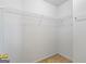 Walk-in closet with white wire shelving and neutral carpeting at 825 Karie Dr, Mcdonough, GA 30253