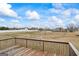Exterior shot from wooden deck overlooking backyard and neighboring properties at 825 Karie Dr, Mcdonough, GA 30253