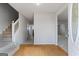 Inviting foyer featuring hardwood floors, staircase, and open access to living spaces at 825 Karie Dr, Mcdonough, GA 30253