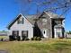 Charming two-story home featuring stone accents and black shutters enhancing curb appeal at 825 Karie Dr, Mcdonough, GA 30253