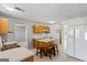 Kitchen features a kitchen island with seating, double sinks, and white appliances at 825 Karie Dr, Mcdonough, GA 30253